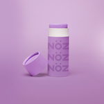 Load image into Gallery viewer, A purple Nöz sunscreen stick in sustainable cardboard packaging. The stick is mineral sunscreen that is reef-safe, waterproof and dermatologist recommended.

