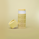 Load image into Gallery viewer, A yellow Nöz sunscreen stick in sustainable cardboard packaging. The stick is mineral sunscreen that is reef-safe, waterproof and dermatologist recommended.
